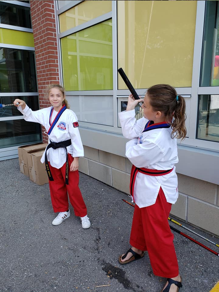 Warming up outside of the local school%2C before self-defense demo class